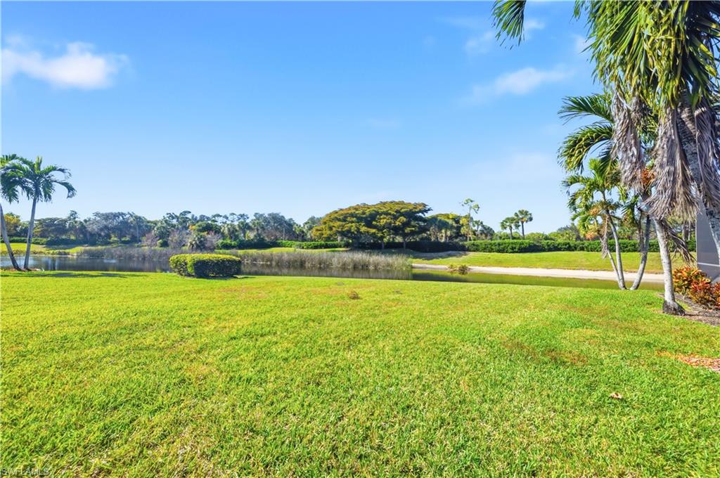 1411 Princess Sabal Point Naples, FL 34119 - Photo 17 of 30 a view of a lake with a big yard