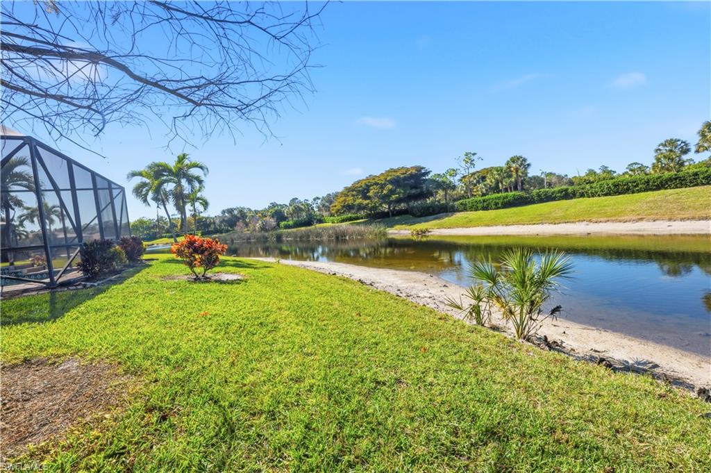 1411 Princess Sabal Point Naples, FL 34119 - Photo 18 of 30 a view of a lake with a garden