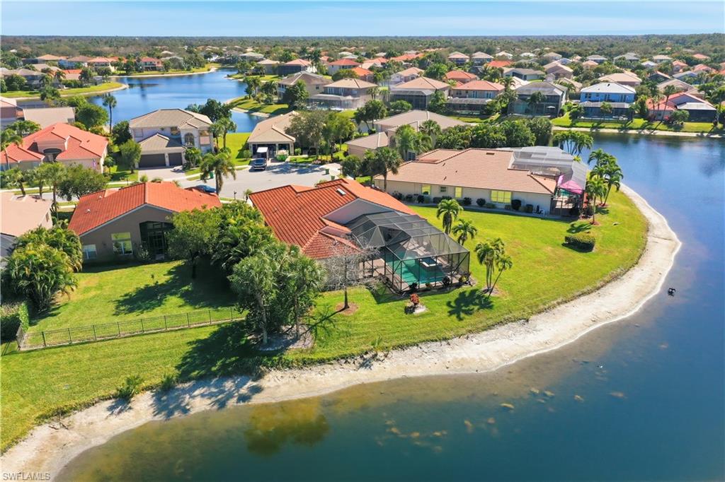 1411 Princess Sabal Point Naples, FL 34119 - Photo 2 of 32 Aerial perspective of suburban area with a large body of water