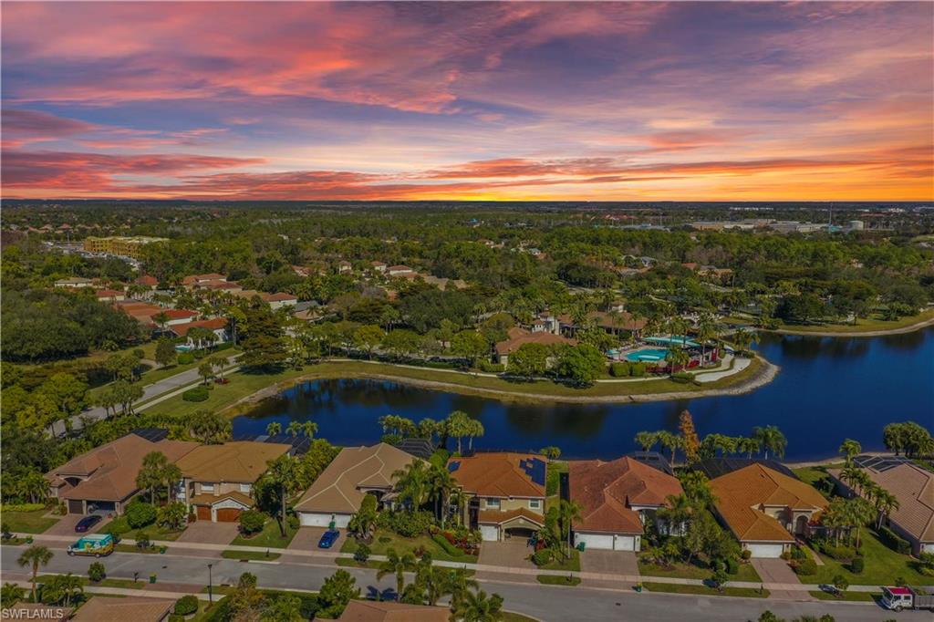 1411 Princess Sabal Point Naples, FL 34119 - Photo 23 of 32 Aerial perspective of suburban area with a nearby body of water