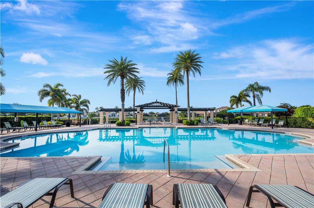 1411 Princess Sabal Point Naples, FL 34119 - Photo 24 of 30 a view of a swimming pool with furniture