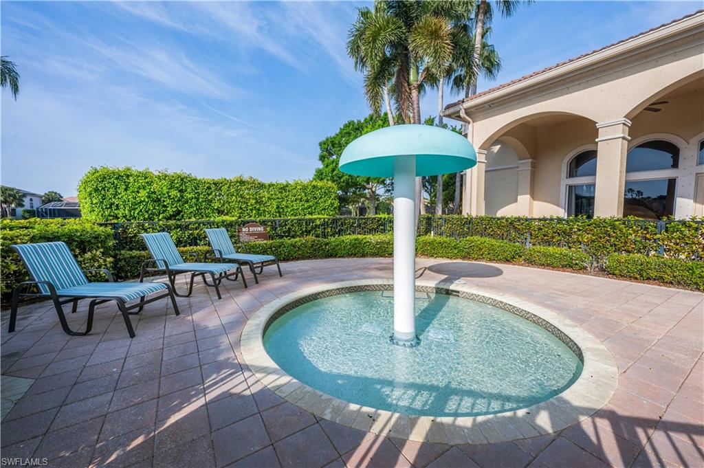 1411 Princess Sabal Point Naples, FL 34119 - Photo 26 of 30 a swimming pool with outdoor seating yard and slide