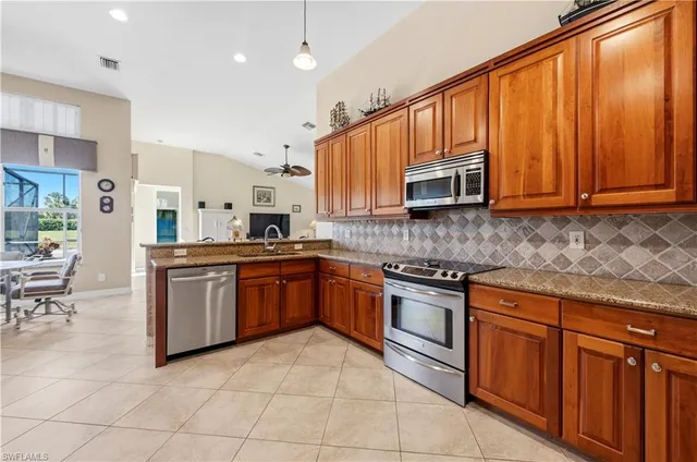 a view of a dining room with furniture wooden floor and chandelier