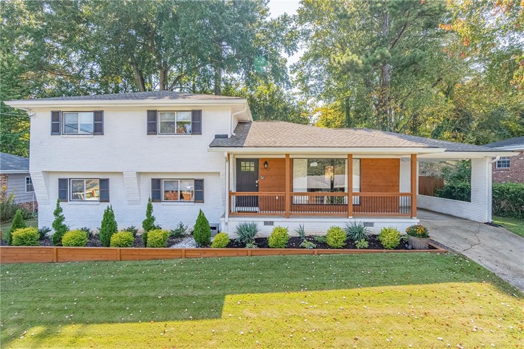 2941 Edna Lane Decatur, GA 30032 - Photo 1 of 1 a view of a house with a yard and plants