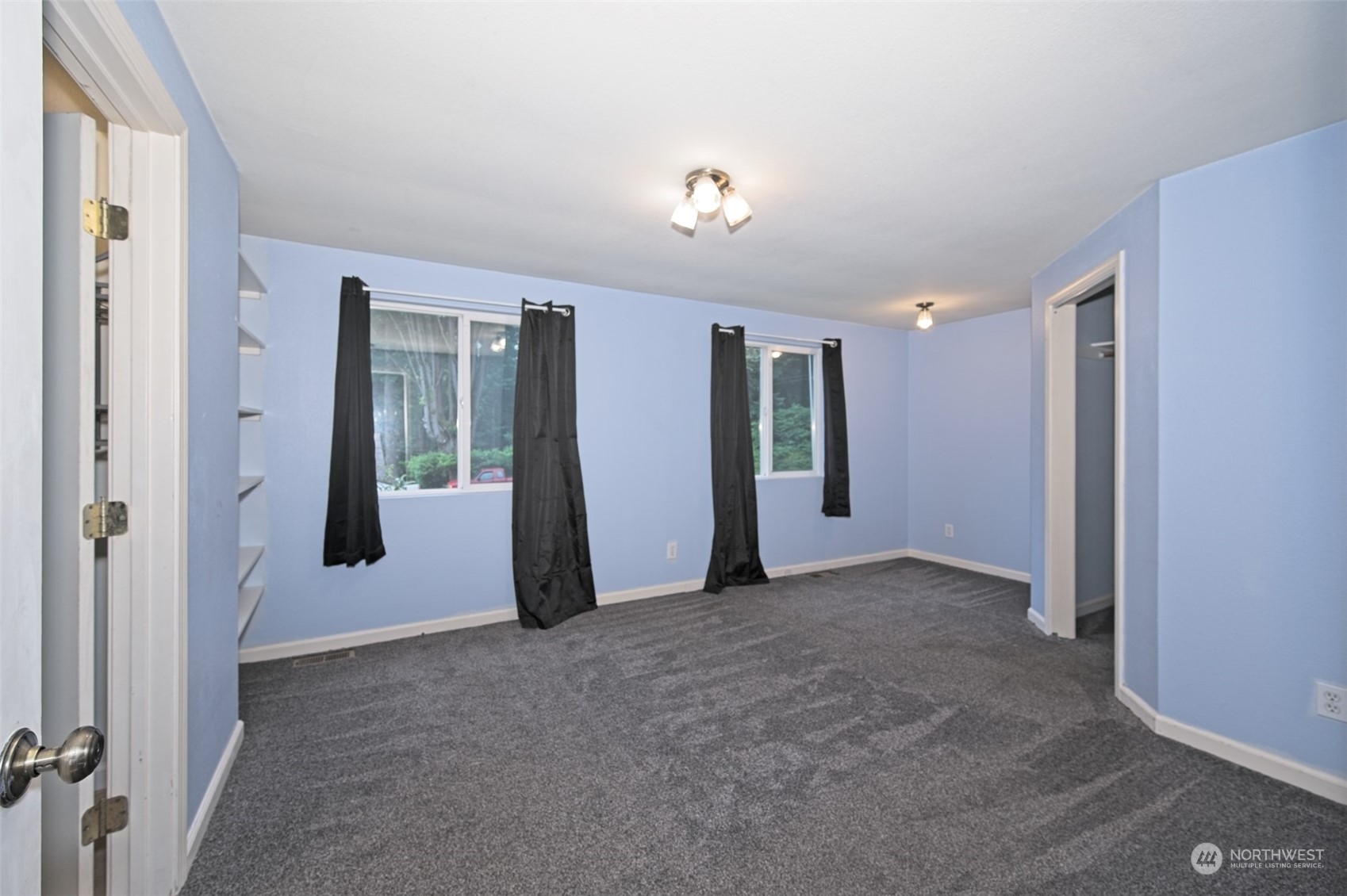 8121 Shoemaker Road Marysville, WA 98271 - Photo 14 of 20 an empty room with closet and windows