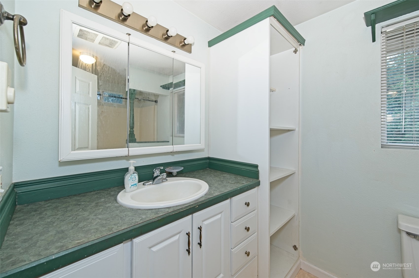 8121 Shoemaker Road Marysville, WA 98271 - Photo 15 of 20 a bathroom with a sink and a mirror