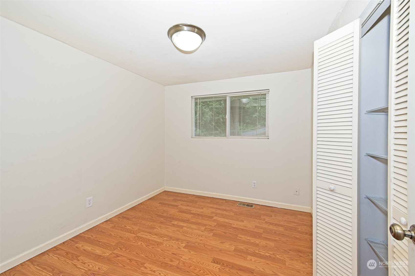 8121 Shoemaker Road Marysville, WA 98271 - Photo 17 of 20 a view of empty room with wooden floor