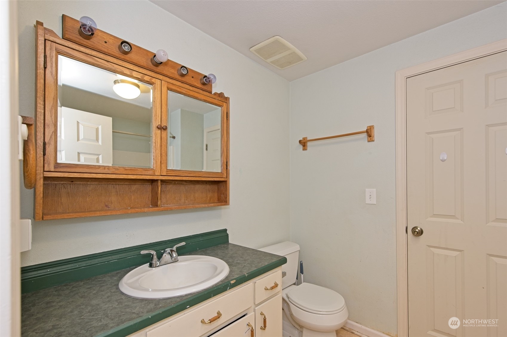 8121 Shoemaker Road Marysville, WA 98271 - Photo 20 of 20 a bathroom with a sink a toilet a mirror and shower