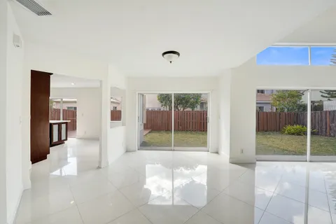 a view of an empty room and wooden floor