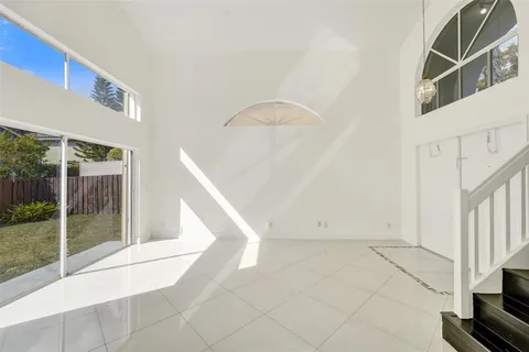 a bathroom with a toilet sink vanity and mirror