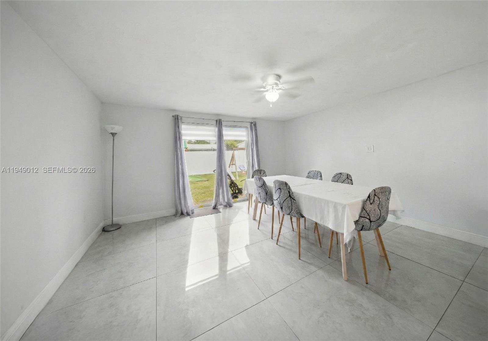 6971 Southwest 24th Street Miramar, FL 33023 - Photo 12 of 22 a view of a dining room with furniture and a chandelier