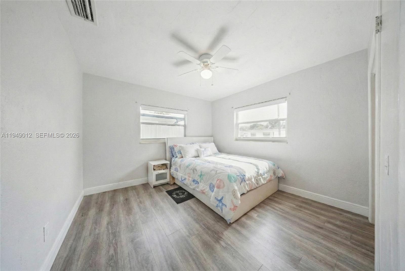 6971 Southwest 24th Street Miramar, FL 33023 - Photo 16 of 22 a bedroom with a bed and a window