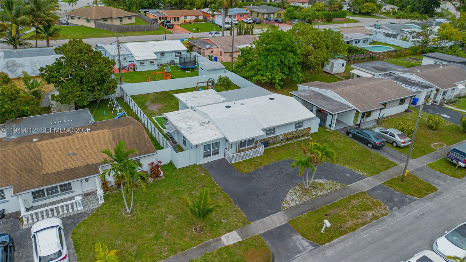 6971 Southwest 24th Street Miramar, FL 33023 - Photo 5 of 22 an aerial view of a house with swimming pool and outdoor seating