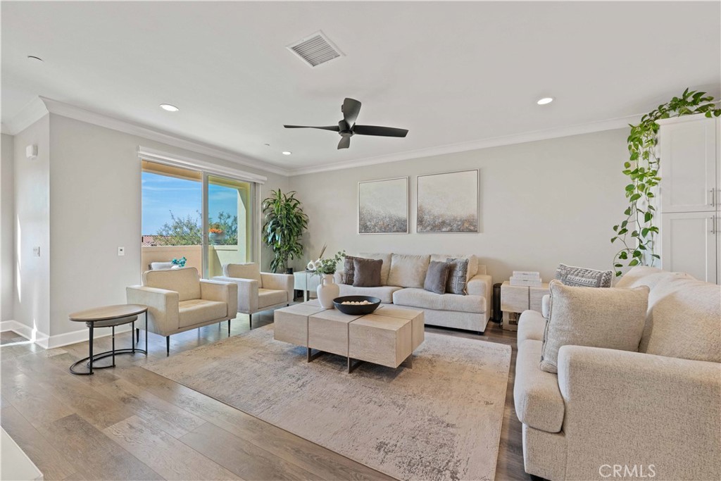 135 Alder Ridge Lake Forest, CA 92610 - Photo 14 of 30 a living room with furniture ceiling fan and a window