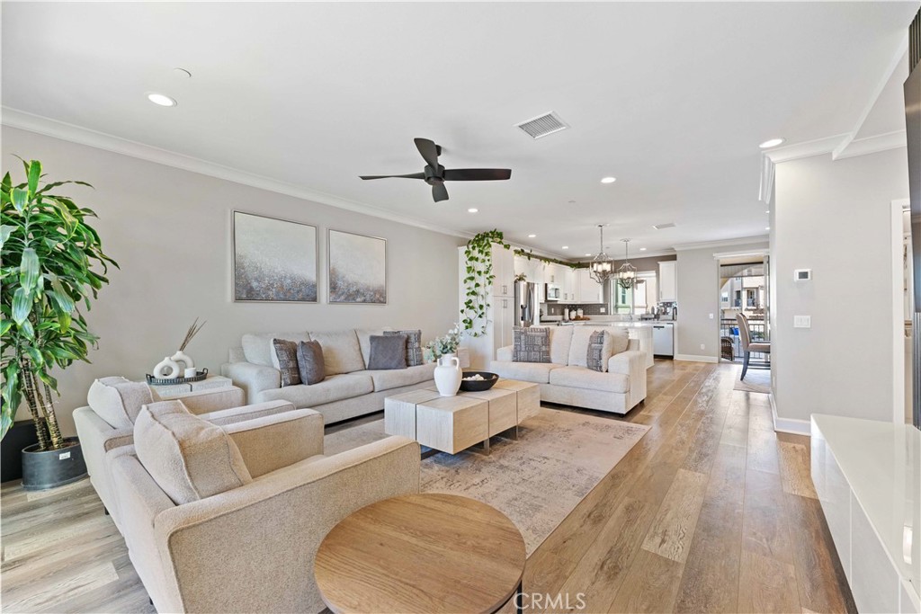 135 Alder Ridge Lake Forest, CA 92610 - Photo 16 of 30 a living room with furniture a ceiling fan and a rug