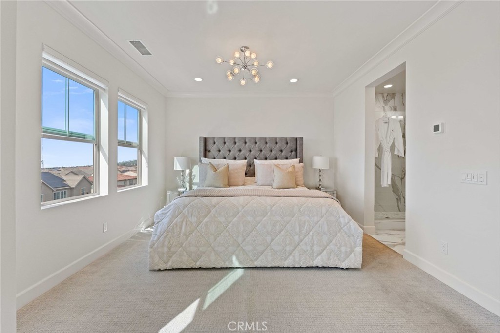135 Alder Ridge Lake Forest, CA 92610 - Photo 20 of 30 a large bed sitting in a bedroom next to a window