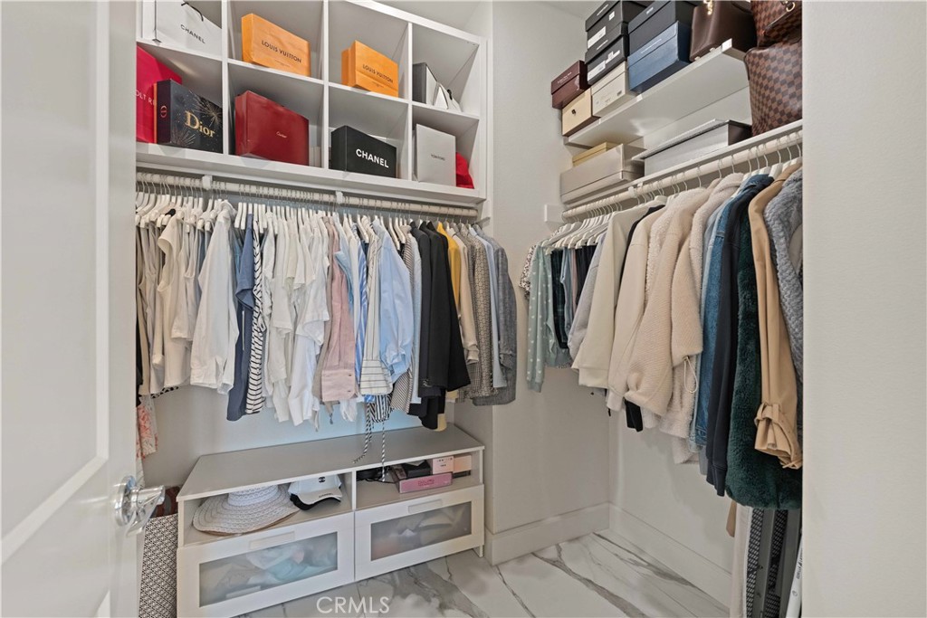 135 Alder Ridge Lake Forest, CA 92610 - Photo 23 of 30 a view of walk in closet with clothes and shoes