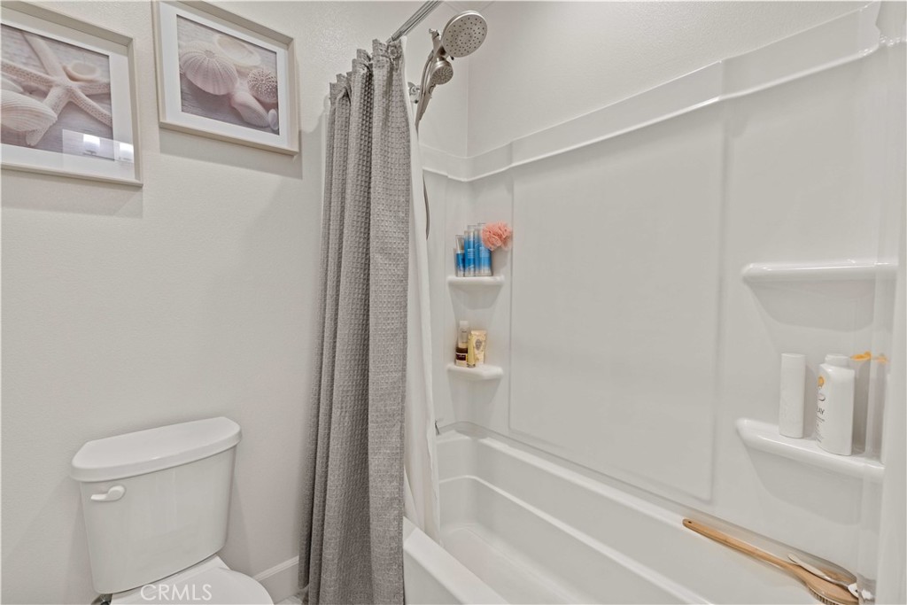135 Alder Ridge Lake Forest, CA 92610 - Photo 25 of 30 a bathroom with a shower and a toilet