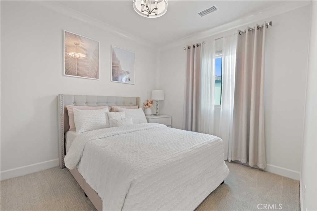 135 Alder Ridge Lake Forest, CA 92610 - Photo 26 of 30 a large white bed in a white room