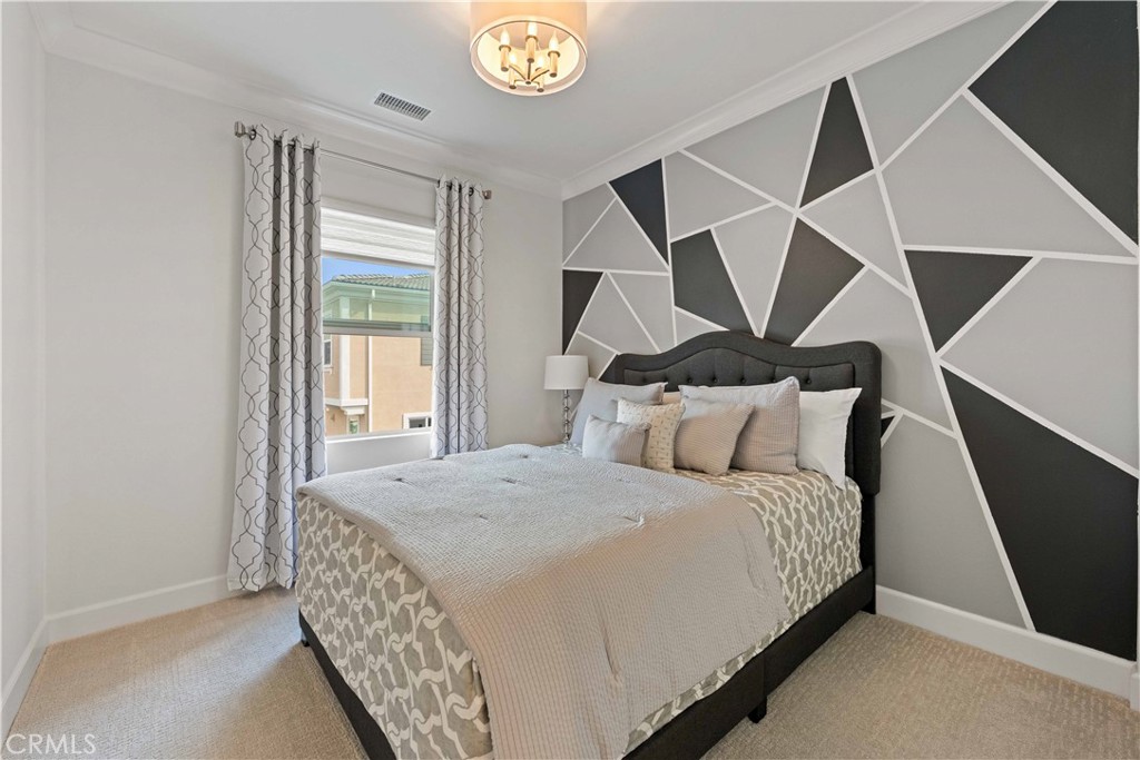 135 Alder Ridge Lake Forest, CA 92610 - Photo 27 of 30 a bedroom with a bed and a window
