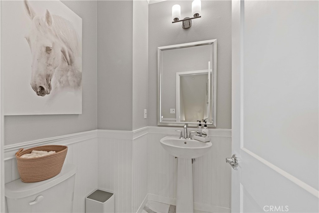 135 Alder Ridge Lake Forest, CA 92610 - Photo 6 of 30 a bathroom with a toilet sink and mirror