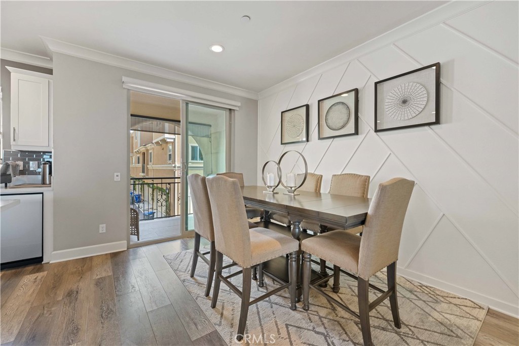 135 Alder Ridge Lake Forest, CA 92610 - Photo 7 of 30 a view of a dining room with furniture window and wooden floor