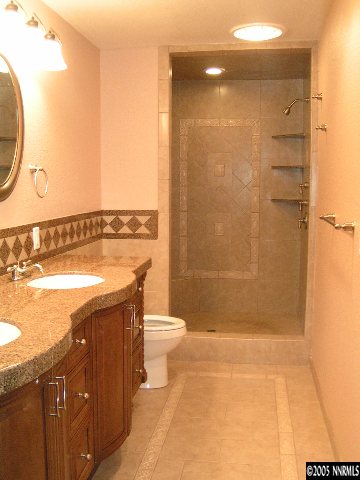 1825 Wesley Drive Reno, NV 89503 - Photo 3 of 5 a bathroom with a granite countertop sink a toilet and shower