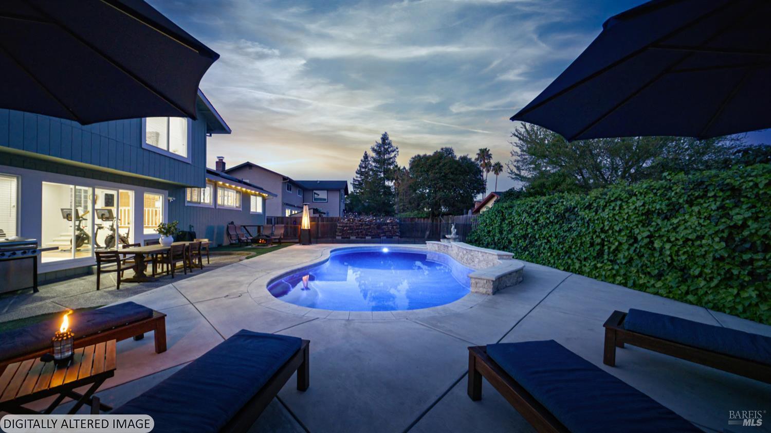 5328 Daniel Drive Rohnert Park, CA 94928 - Photo 38 of 42 a view of a patio with couches table and chairs under an umbrella
