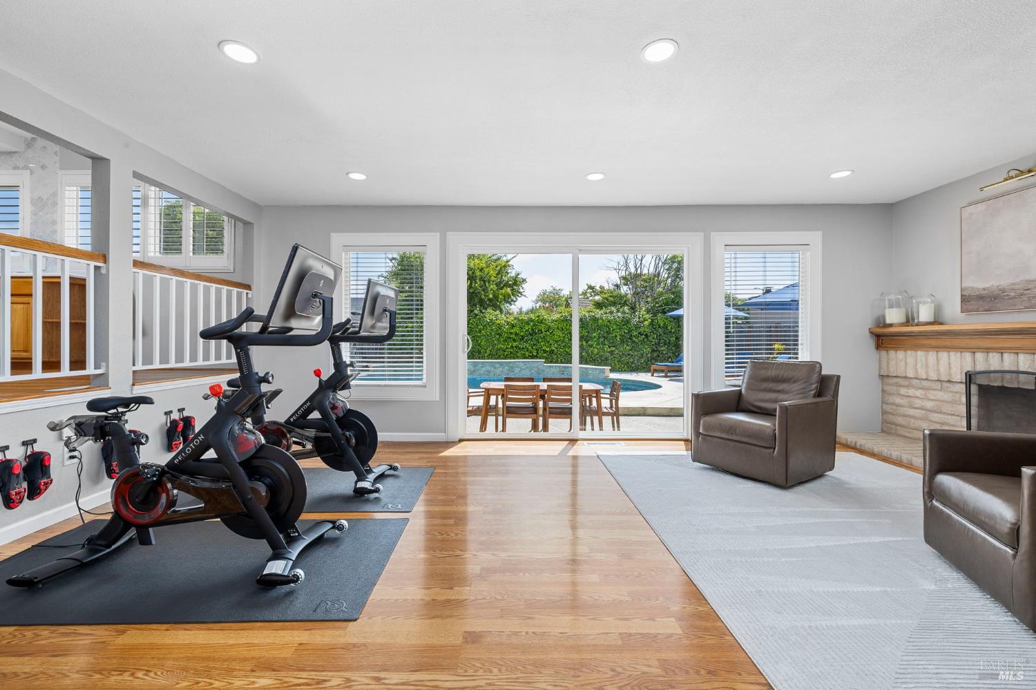 5328 Daniel Drive Rohnert Park, CA 94928 - Photo 10 of 42 a living room with furniture large windows and a fireplace