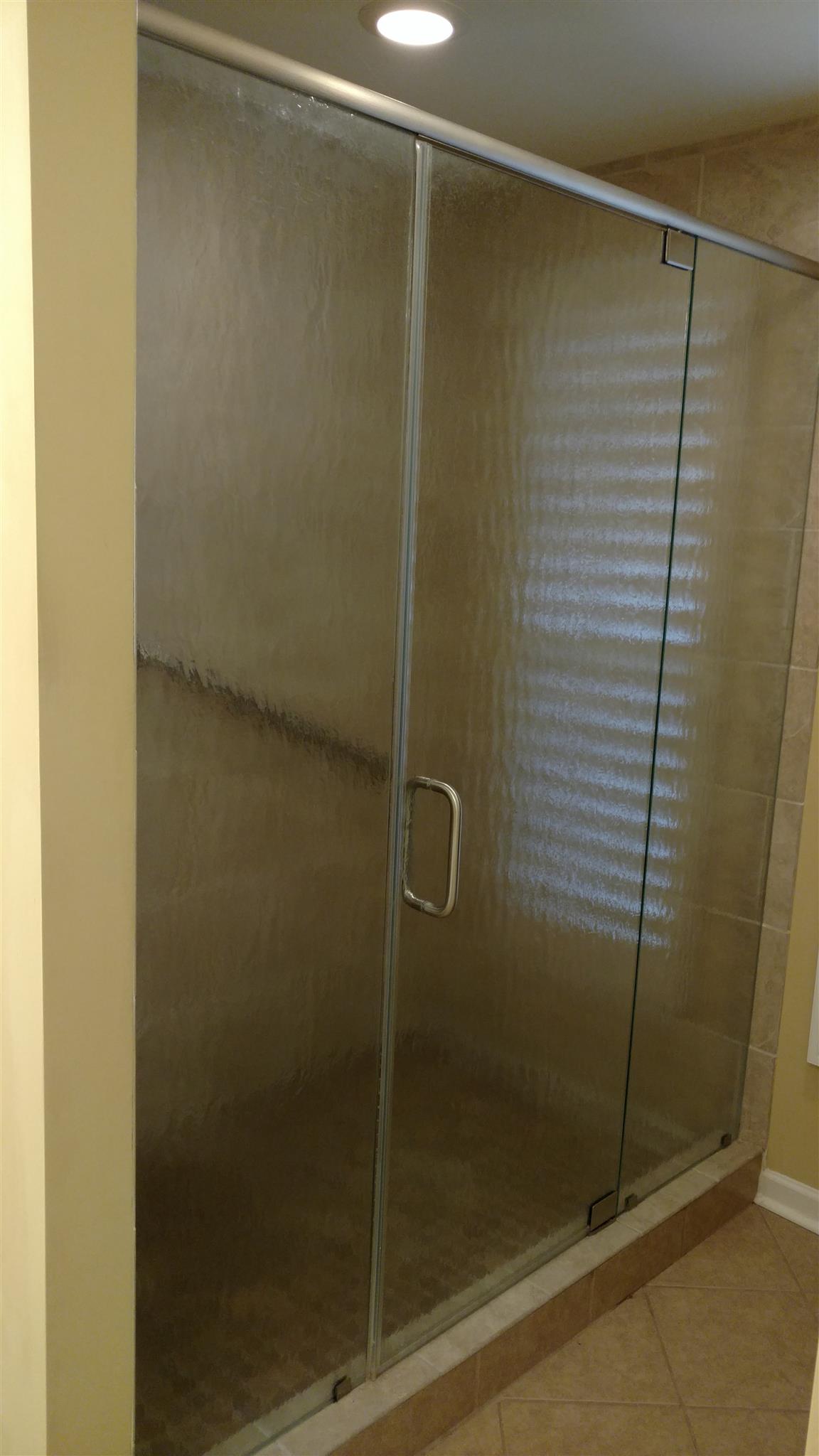 1246 General George Patton Road, Unit 1246 Nashville, TN 37221 - Photo 4 of 7 a bathroom with a glass shower door