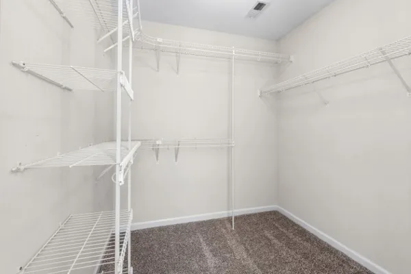 a view of an empty walk in closet