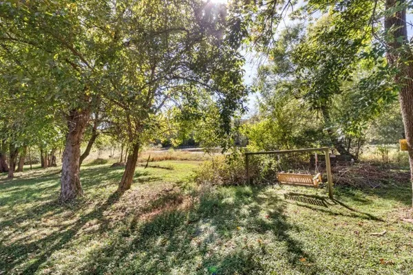 a backyard of a house with lots of green space