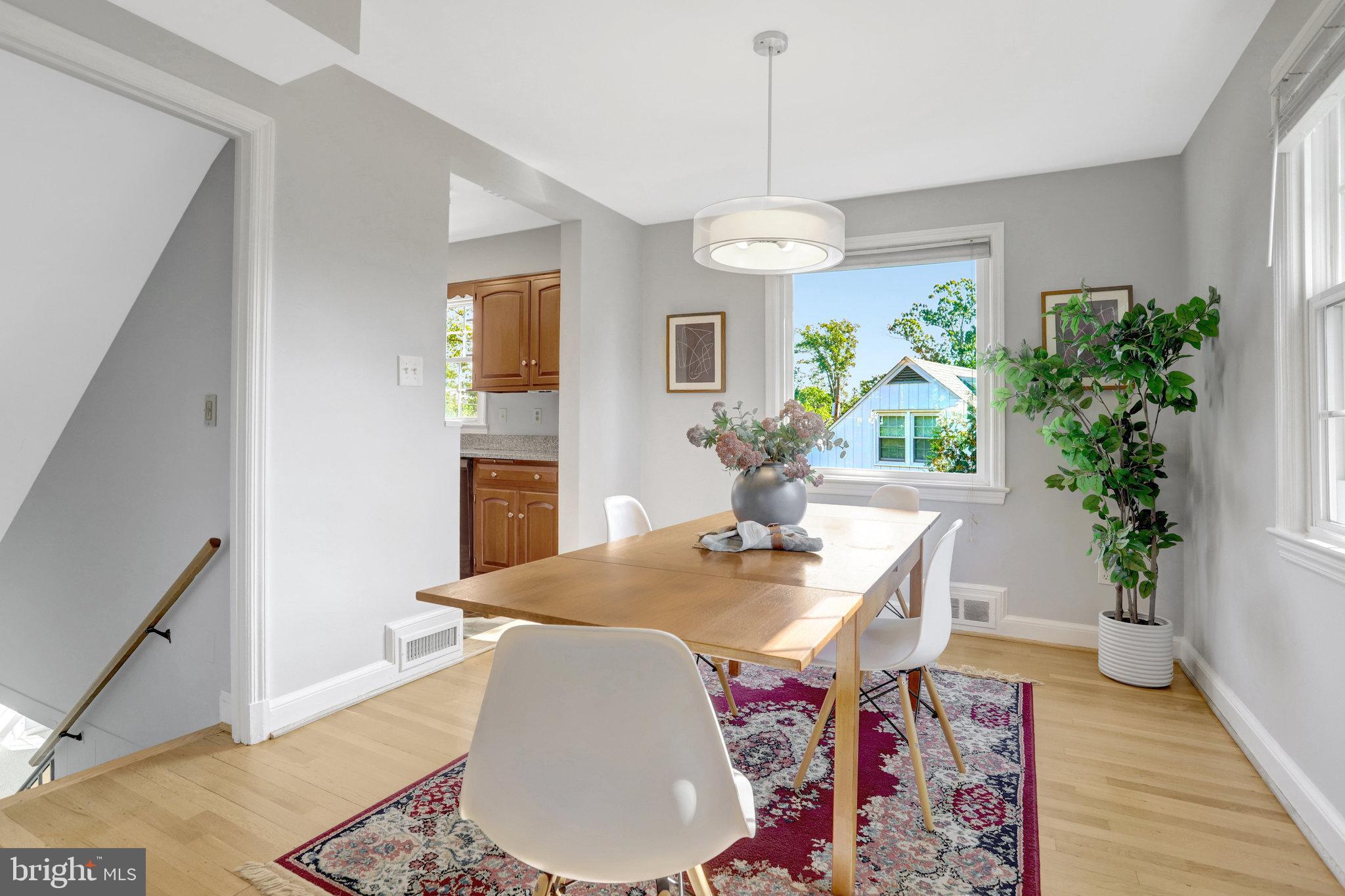2911 Edgehill Drive Alexandria, VA 22302 - Photo 11 of 38 a view of a dining room with furniture window and wooden floor