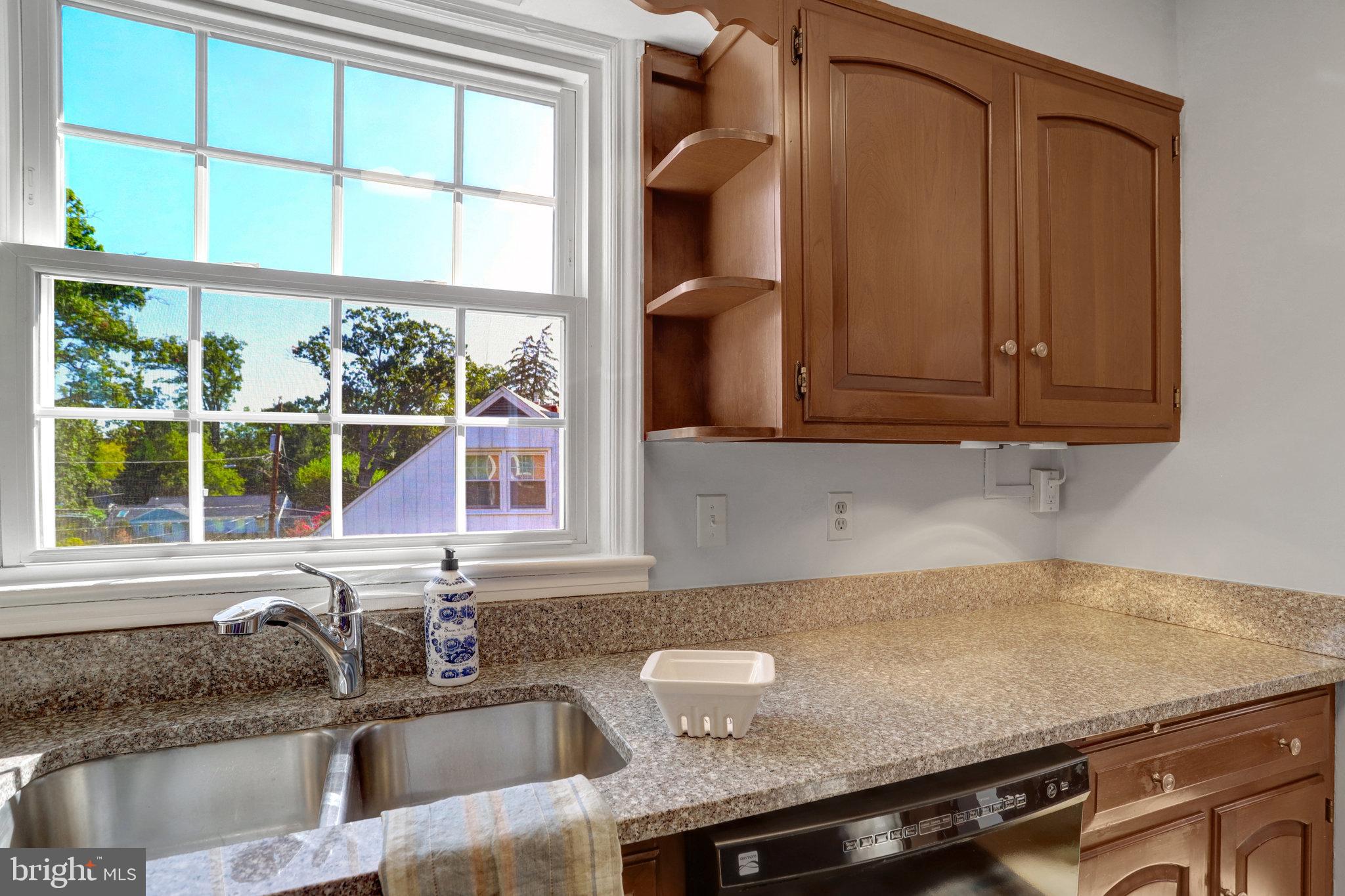 2911 Edgehill Drive Alexandria, VA 22302 - Photo 14 of 38 a kitchen with granite countertop a sink and a window
