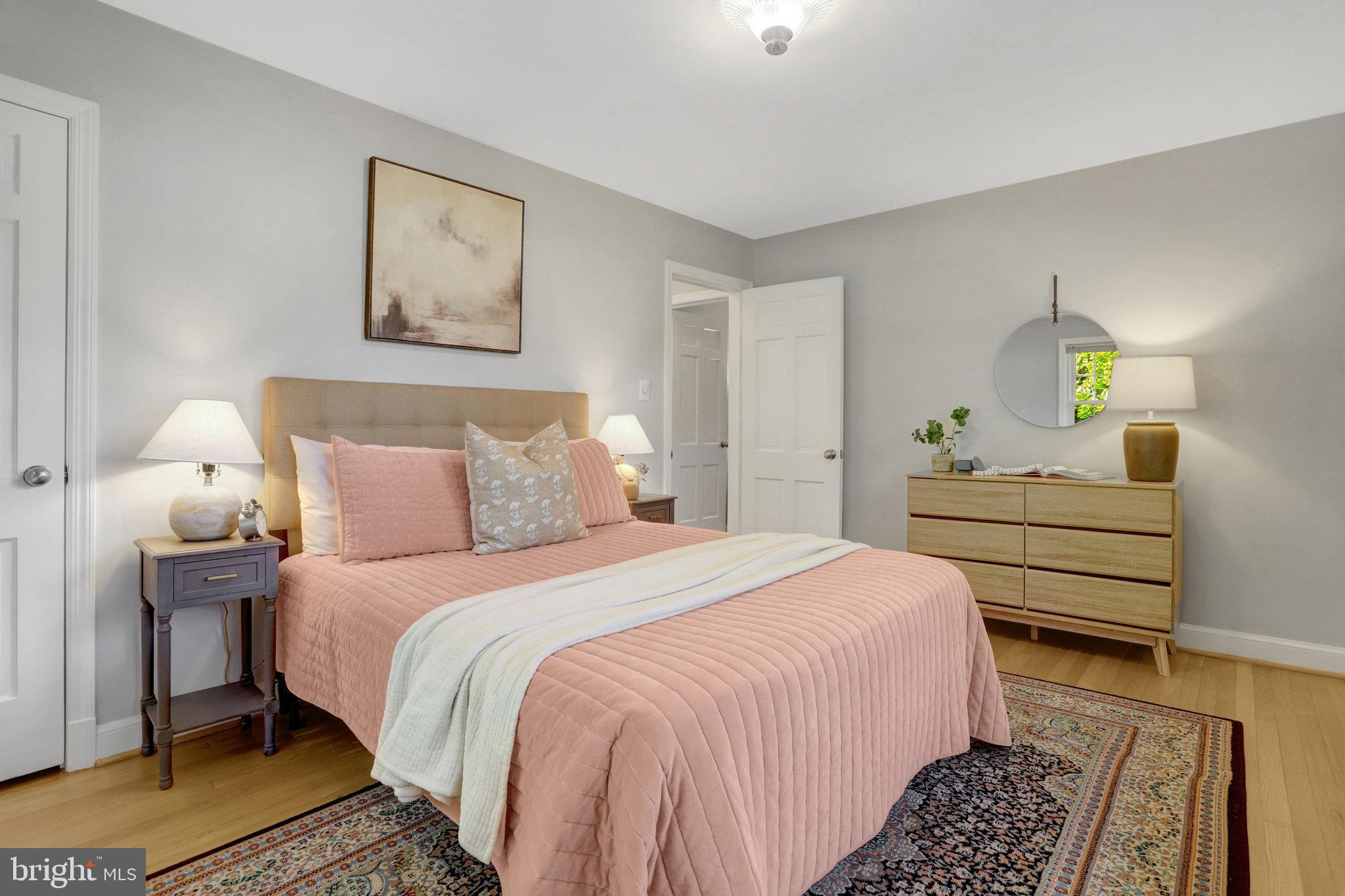 2911 Edgehill Drive Alexandria, VA 22302 - Photo 16 of 38 a bedroom with a bed and a lamp on dresser