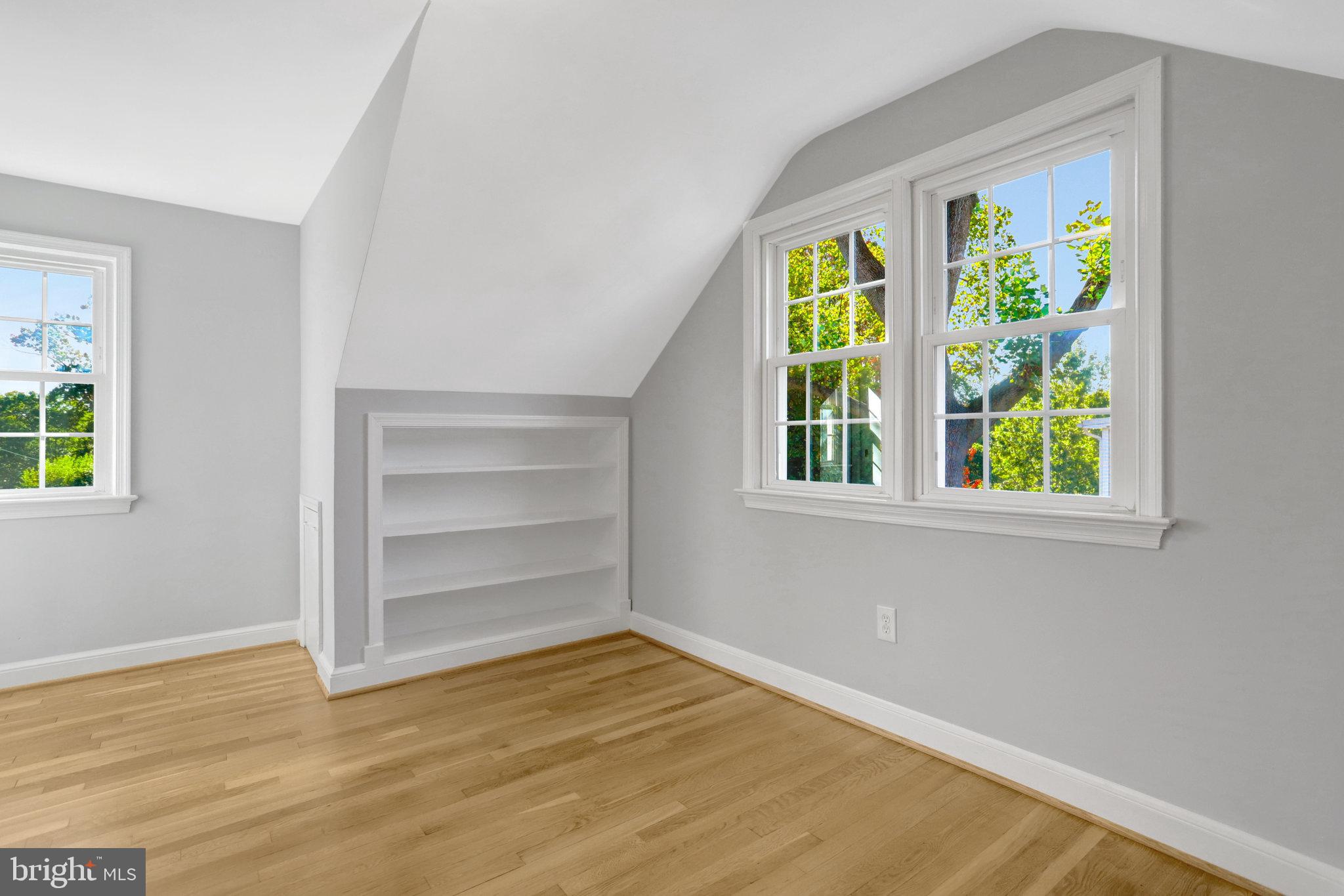 2911 Edgehill Drive Alexandria, VA 22302 - Photo 22 of 38 a view of an empty room with a window and wooden floor