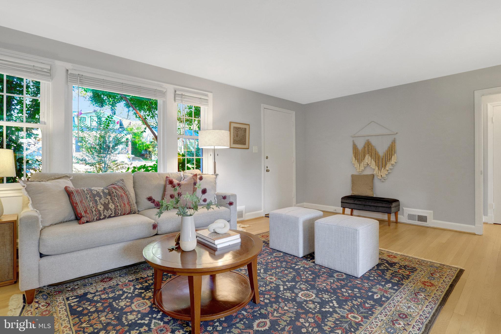 2911 Edgehill Drive Alexandria, VA 22302 - Photo 4 of 38 a living room with furniture a window and a dining table