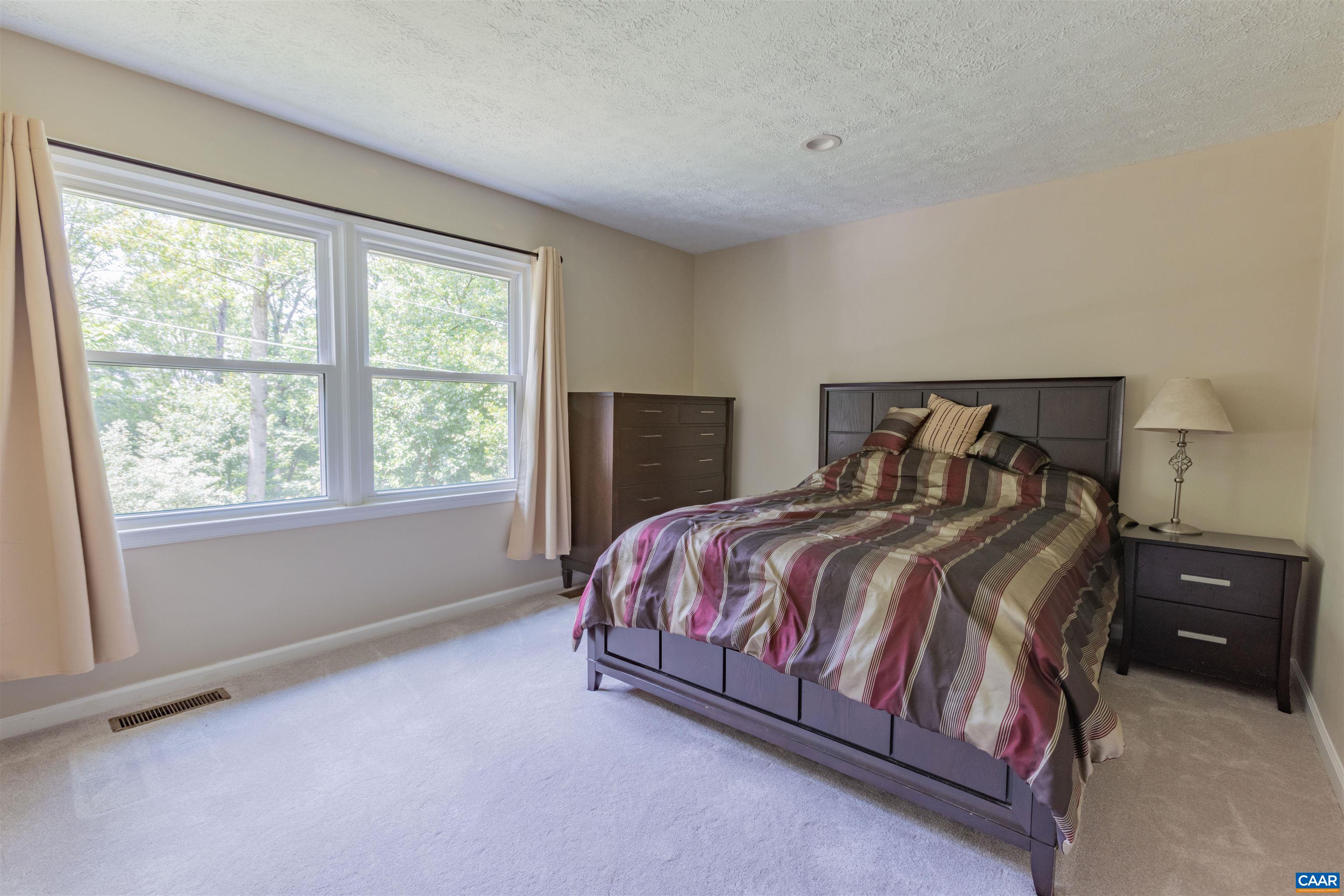 2550 Proffit Road Charlottesville, VA 22911 - Photo 13 of 41 a bedroom with a bed and window