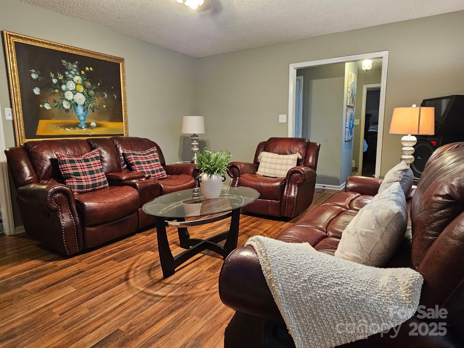 7344 Rena Mae Lane Charlotte, NC 28227 - Photo 9 of 19 a living room with furniture and a flat screen tv