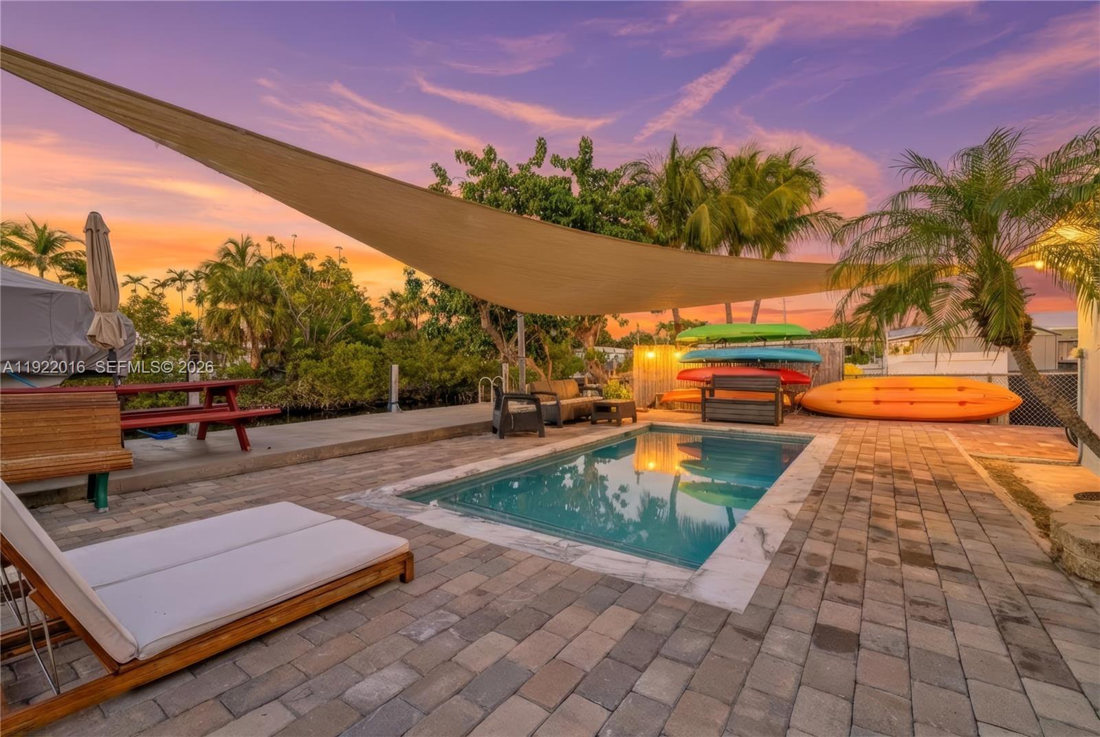 a view of a swimming pool with an outdoor seating