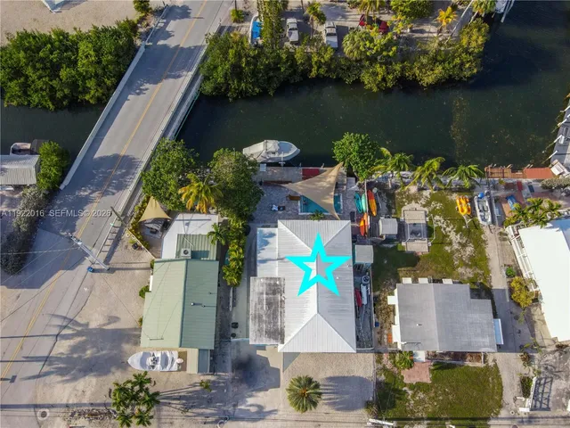 an aerial view of houses with outdoor space