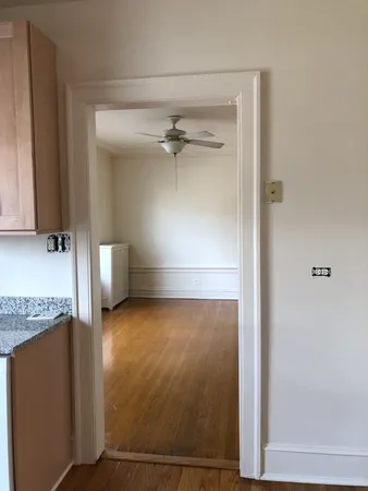 a kitchen with stainless steel appliances granite countertop a stove a sink and dishwasher with wooden floor