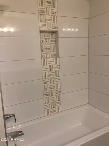 a view of a pathway both side of the house