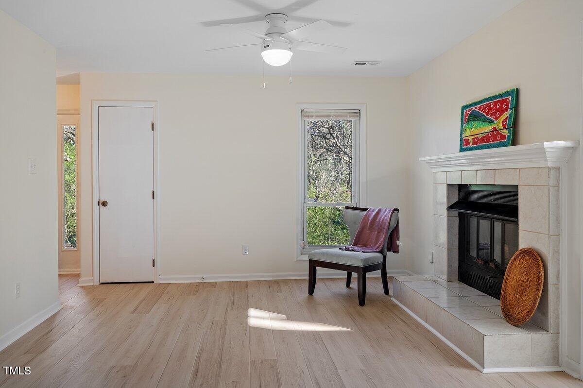 205 Clancy Circle Cary, NC 27511 - Photo 11 of 36 a living room with furniture and a fireplace