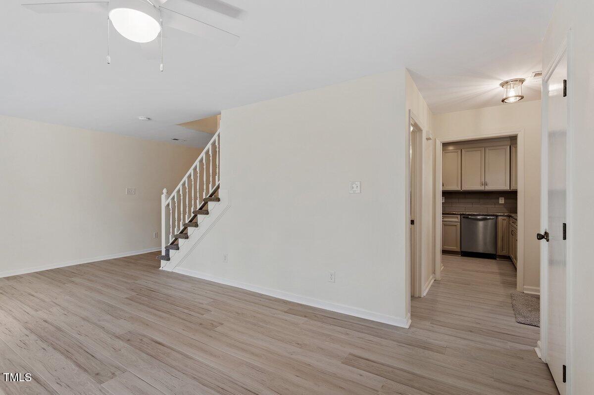 205 Clancy Circle Cary, NC 27511 - Photo 13 of 36 a view of a hallway with wooden floor and a space