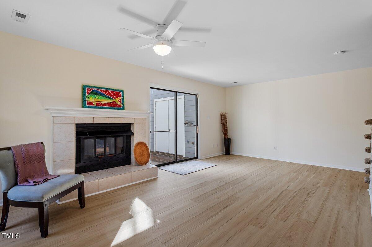 205 Clancy Circle Cary, NC 27511 - Photo 14 of 36 a living room with furniture and a fireplace