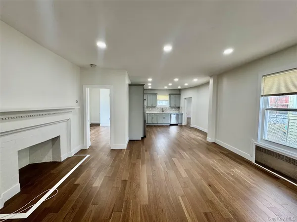 a view of kitchen with cabinets and wooden floor