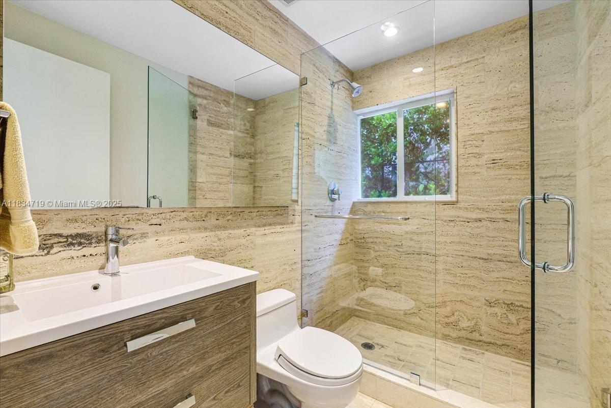 435 Ridgewood Road Key Biscayne, FL 33149 - Photo 24 of 32 a bathroom with a sink a toilet and shower