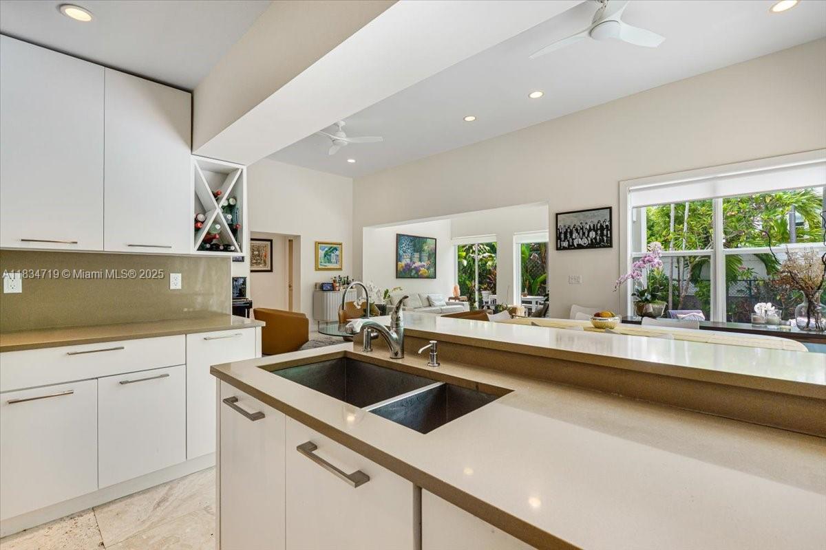 435 Ridgewood Road Key Biscayne, FL 33149 - Photo 8 of 32 a kitchen that has a sink and a stove