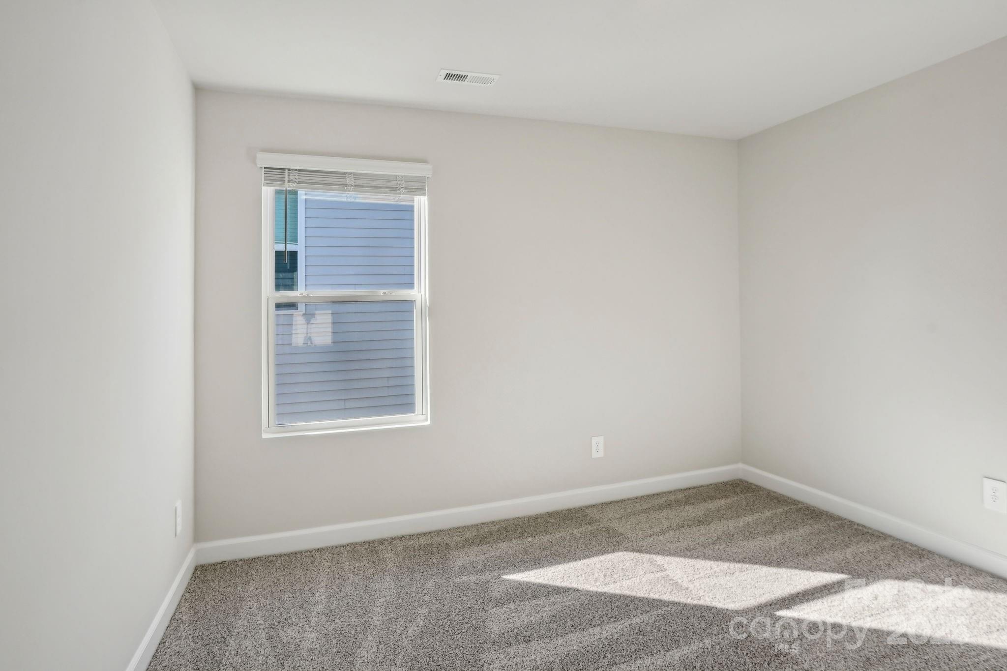 1265 30th St Lane Northeast Conover, NC 28613 - Photo 16 of 24 an empty room with a window